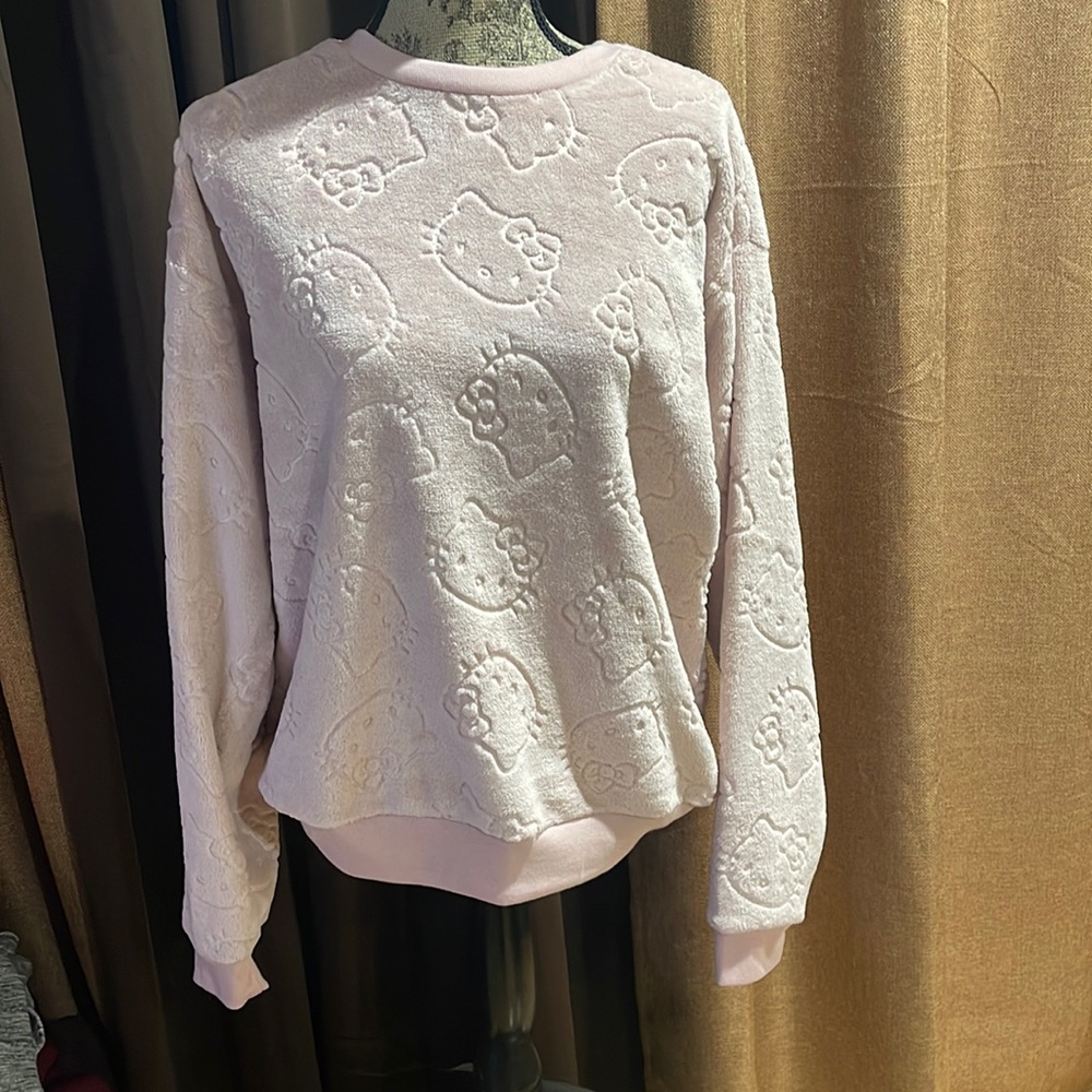 Fleece long sleeve Hello Kitty sweatshirt. NWOT. Size Large. Light pink color.